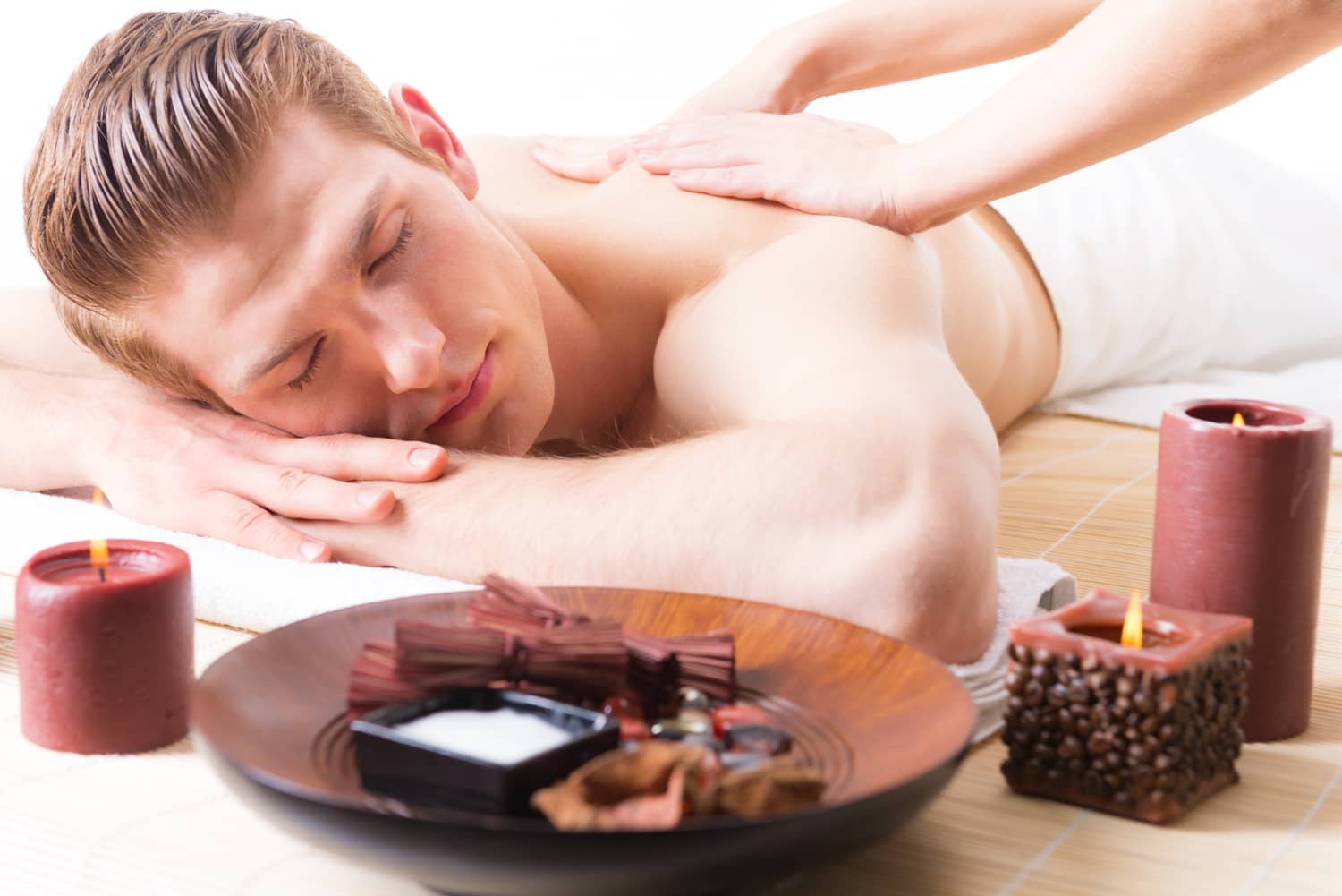 handsome-man-lying-spa-salon-enjoying-deep-tissue-back-massage